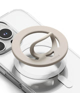 Dual Magnetic Silicone Ring - Beige silicone ring with a pop-out finger loop attached to a clear phone case.
