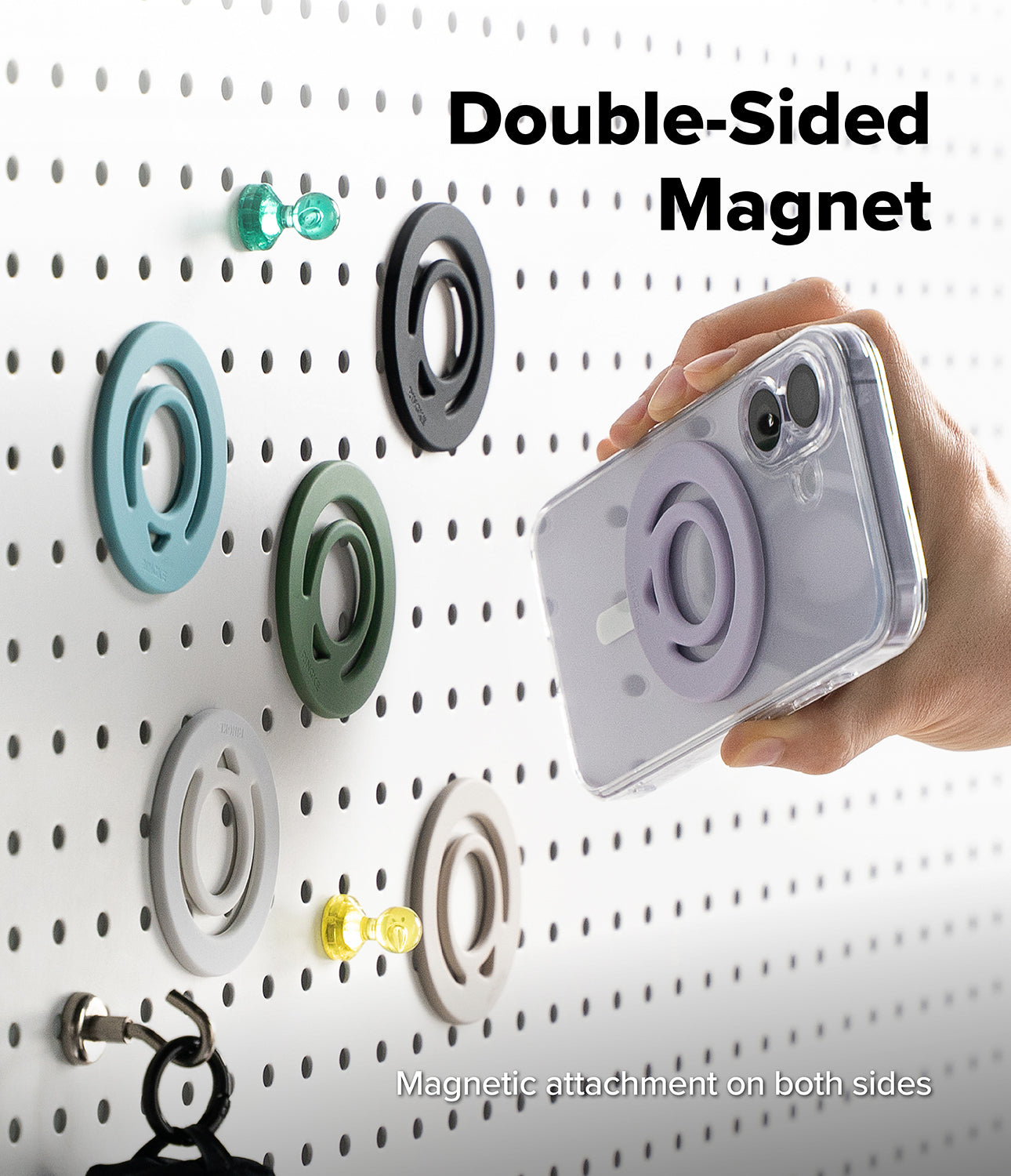 Dual Magnetic Silicone Ring - A hand attaches a phone with a purple magnetic ring to a matching ring mounted on a pegboard.