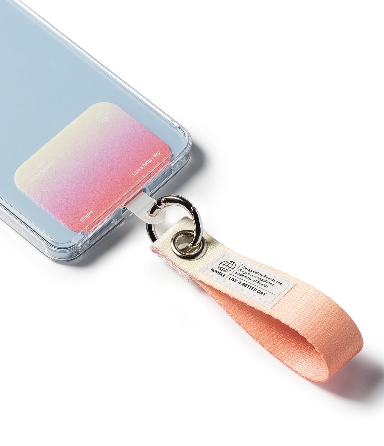 Holder Link Eyelet Keyring - A peach-colored fabric wrist strap attached to a clear phone case via a metal ring and eyelet.