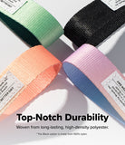 Holder Link Eyelet Keyring - Four looped nylon straps in mint, black, peach, and lavender, each with a white brand label.