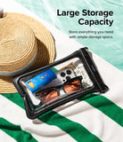 Palm Leaves / Banana Floating Strap & Floating Waterproof Pouch | Black waterproof pouch with items on a green and white striped fabric background