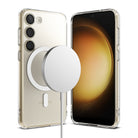 Galaxy S23 Case | Fusion Magnetic Matte - Clear phone case on a Galaxy S23 with a white magnetic wireless charger attached.
