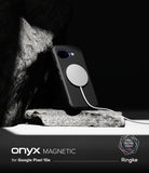 Ringke Onyx Magnetic black rugged case with magnetic charger on a rock against a dark background.