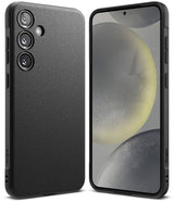 Galaxy S24 Case | Onyx - Multiple textured Onyx phone cases for Galaxy S24 arranged on a dark surface against a green wall.