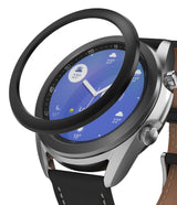 Galaxy Watch 3 (41mm) | Bezel Styling - Galaxy Watch 3 (41mm) - A black adhesive bezel ring hovering above a silver smartwatch with a blue weather watch face.