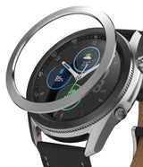 Galaxy Watch 3 (45mm) | Bezel Styling - A silver metal bezel ring hovering above a Galaxy Watch 3 with a black leather strap.