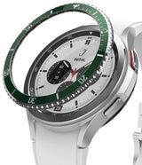 Galaxy Watch 4 Classic 42mm | Bezel Styling - Four Galaxy Watch 4 Classic units with various colored bezel covers on concrete cylinders.