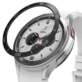 Galaxy Watch 4 Classic 42mm | Bezel Styling - Silver smartwatch with a tachymeter bezel accessory on a black display stand.