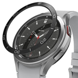 Galaxy Watch 4 Classic 46mm | Bezel Styling - Multiple smartwatches with various metallic bezel covers on a black stand.