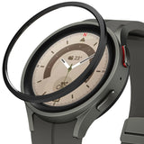 Galaxy Watch 5 Pro 45mm | Bezel Styling - A black adhesive bezel ring hovering above a grey Galaxy Watch 5 Pro.