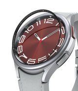 Galaxy Watch 6 Classic 43mm | Inner Bezel Styling - Galaxy Watch 6 Classic 43mm - A black inner bezel ring hovering above a silver smartwatch with a red analog watch face.