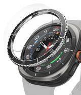 Galaxy Watch Ultra | Bezel Styling Premium & Glass - Galaxy Watch Ultra - A metallic, notched bezel styling ring hovering above a Galaxy Watch Ultra with a digital face.