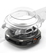 Galaxy Watch Ultra | Slim Extend & Glass - A clear protective case hovering over a Galaxy Watch Ultra amidst many cases.