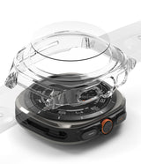 Galaxy Watch Ultra | Slim Extend & Glass - Clear protective case hovering over a Galaxy Watch Ultra on a gray surface.