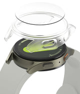 Galaxy Watch 7 (40mm) | Slim & Glass - Exploded view of a clear protective case and glass screen protector above a smartwatch.