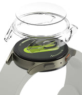 Galaxy Watch 7 (40mm) | Slim & Glass - Clear protective case hovering above a Galaxy Watch 7 with a green watch face.