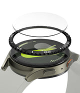 Galaxy Watch 7 (40mm) | Bezel Styling & Glass - Exploded view of a smartwatch with a black bezel ring and glass screen protector hovering above.