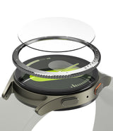 Galaxy Watch 7 (40mm) | Bezel Styling & Glass - Exploded view of a smartwatch with a floating metal bezel and glass screen protector.