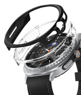 Galaxy Watch 8 Classic 46mm Case | Slim - Exploded view of a black and clear protective case hovering over a silver smartwatch.