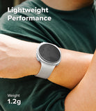 Galaxy Watch 8 40mm Case | Slim - A close-up of a person's wrist wearing a light gray smartwatch with a dark screen, over a dark green shirt. White text overlays read 'Lightweight Performance' and 'Weight 1.