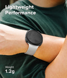 Galaxy Watch 8 40mm Case | Slim - A close-up of a person's wrist wearing a smartwatch with a light gray band and black round face, over a dark green shirt. White text reads 'Lightweight Performance' and 'Weight 1.