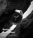 Galaxy Watch 8 40mm Case | Slim - A smartwatch with a white band and black round face is nestled between dark rock formations. Large white text at the bottom reads 'Seamless Protection' with smaller text 'Blocks scratches and dust.