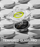 Galaxy Watch 8 44mm Screen Protector | Tempered Glass Pro - Ringke tempered glass screen protectors shown in a clean studio-style arrangement, with one transparent protector lifted over a black watch face and others stacked in the background. Text at the bottom reads 'Ringke TEMPERED GLASS PRO Premium Screen Protector for Galaxy Watch9/8, 44mm'.