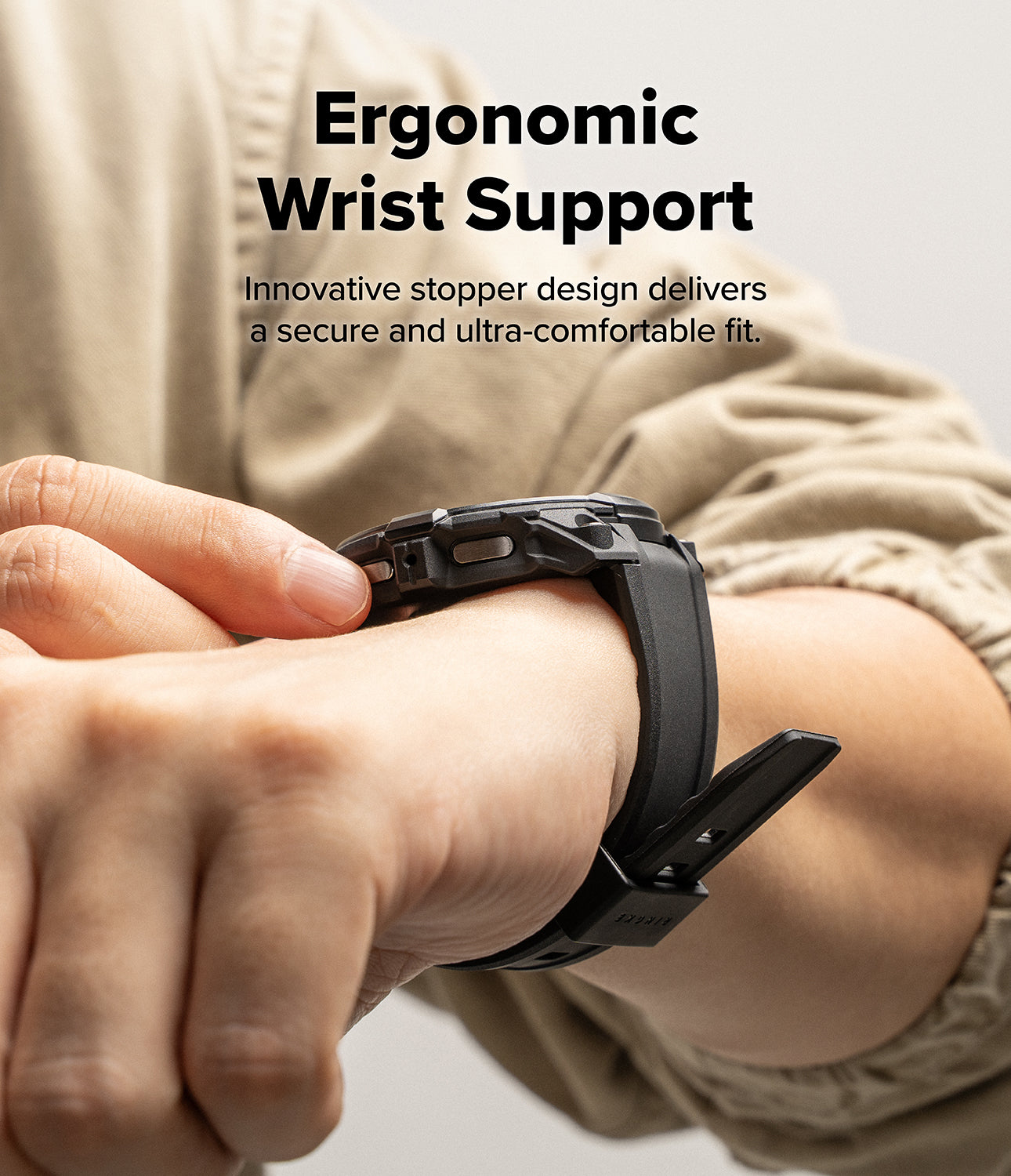 Galaxy Watch 9 / 8 44mm Case + Band | Rugged Gear - Person wearing a black smartwatch with ergonomic wrist support design.