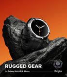 Galaxy Watch 8 44mm Case + Band | Rugged Gear - A black rugged smartwatch with a black face and black strap, resting on a dark rock against an orange gradient background. Text at the bottom reads 'RUGGED GEAR for Galaxy Watch9/8, 44mm' with the Ringke logo.