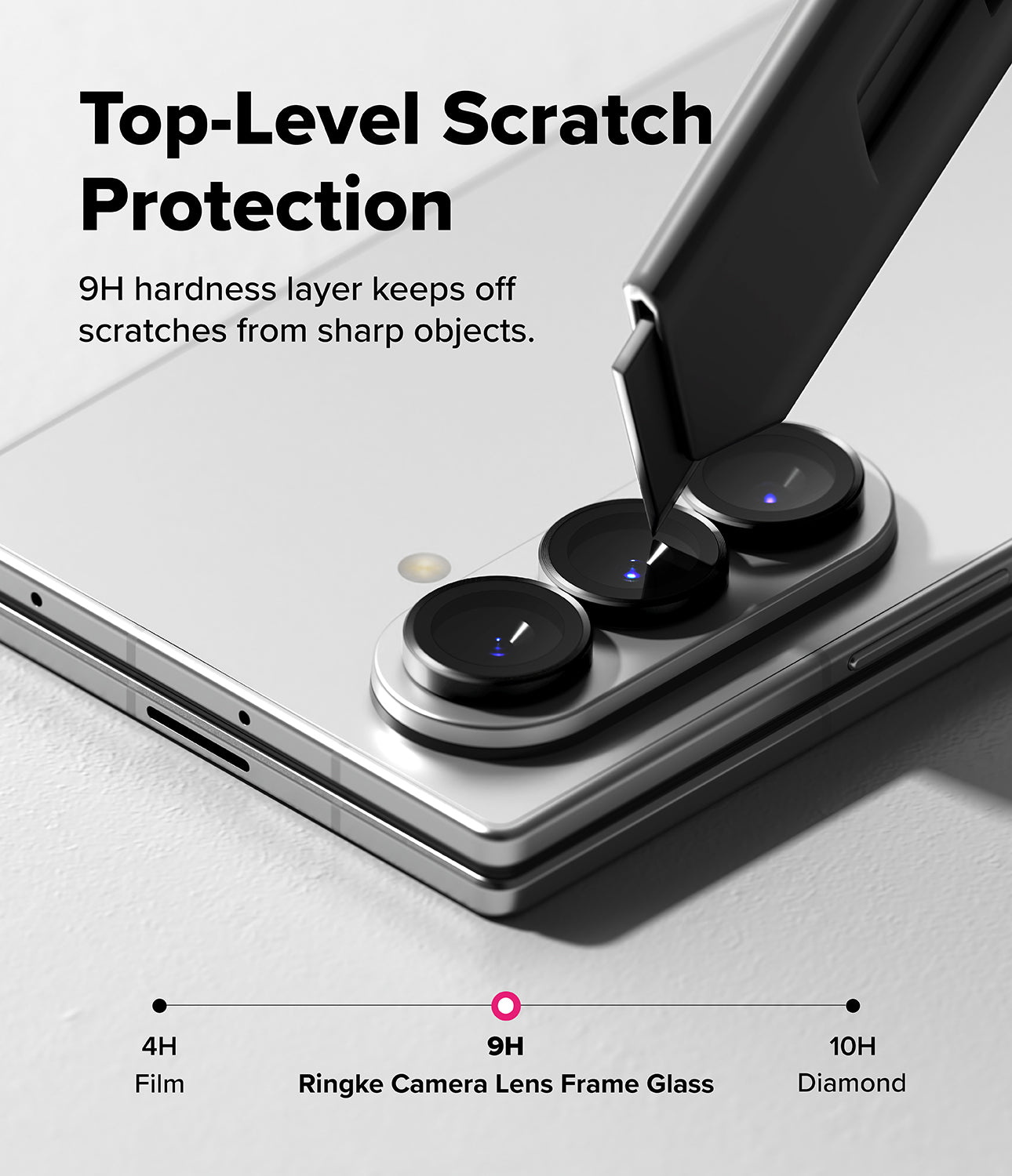 Galaxy Z Fold 8 Ultra | Camera Lens Frame Glass (2 Pack) - A utility knife blade presses against a phone camera lens protector, demonstrating 9H scratch resistance.