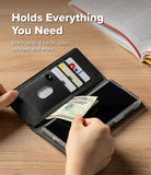 Galaxy Z Fold 8 Ultra MagSafe Wallet | Folio Grip Wallet Magnetic - A black folio-style phone case shown open on a wooden table, with hands placing cash and cards inside. The case has a clear outer shell and includes text that reads 'Holds Everything You Need' and 'Store up to 4 cards, cash, receipts and more.