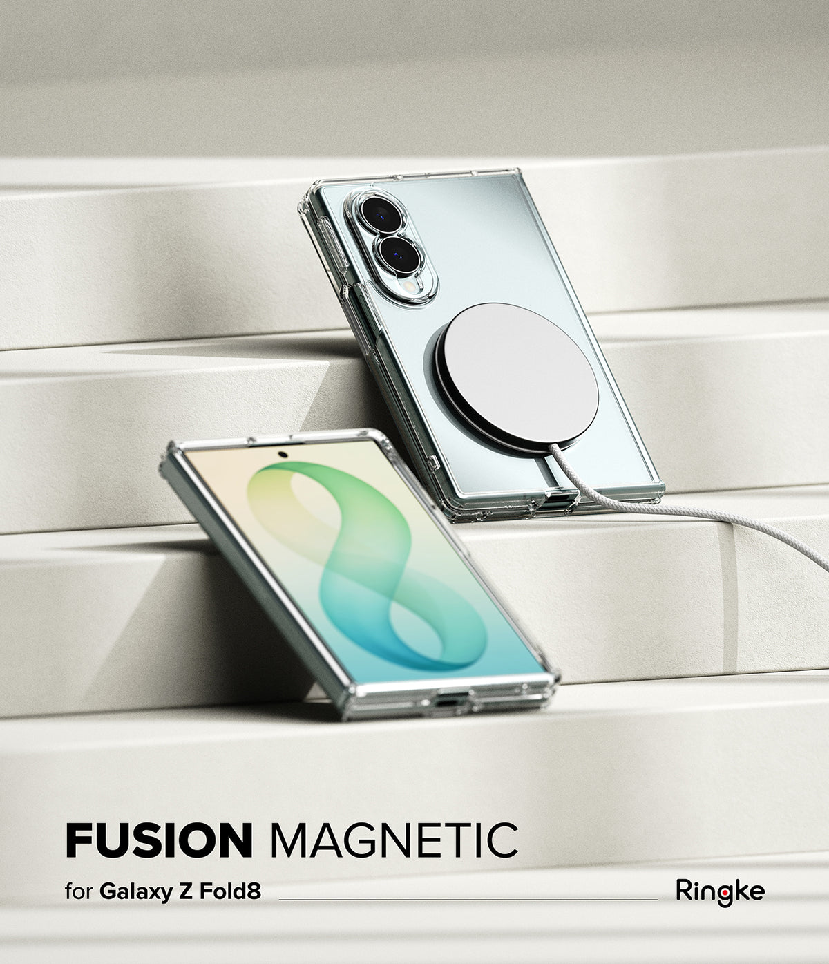 Galaxy Z Fold 8 | Fusion Magnetic - A clear magnetic case shown on a silver Samsung Galaxy Z Fold8 phone, displayed on white geometric steps. The case features a large circular magnetic ring.