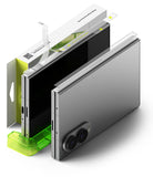 Galaxy Z Fold 8 Hinge Protector | Hinge Dual Easy Film (2 Pack) - A smartphone shown standing upright in a translucent bright green stand, with its retail box behind it on a clean white background. The box is white with lime green panels and visible Ringke branding.