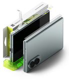 Galaxy Z Fold 8 Hinge Protector | Hinge Dual Easy Film (2 Pack) - A folding smartphone shown in an exploded, layered presentation with its screen partially open, transparent protective film pieces, a bright green stand, and part of the retail box visible on a clean white background.