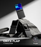 Galaxy Z Flip 8 Case | Onyx Flap - Three black Ringke Onyx Flap cases for Samsung Galaxy Z Flip8 are displayed in a dramatic studio setup with dark rocks. The top case is open, showing a blue and purple screen, while the other two are closed.
