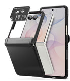 [Bundle] Galaxy Z Flip 8 | Onyx Flap + Camera Protectors (2P) - A black smartphone accessory case with a built-in flip-out camera lens protector, shown attached to a foldable phone. The image displays both the back view of the phone with the case installed and a separate, detached lens protector accessory floating above it on a clean white background.