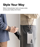 Holder Link Strap | Black - A split view showing a brown strap worn as a wristband and as a crossbody phone lanyard.