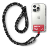 Holder Link Strap | Tarpaulin Red - Black rope lanyard with reflective accents attached to a clear phone case with a red tag.
