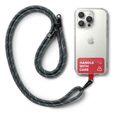 Holder Link Strap | Tarpaulin Red - Grey rope lanyard attached to a clear phone case with a red Handle With Care tab.