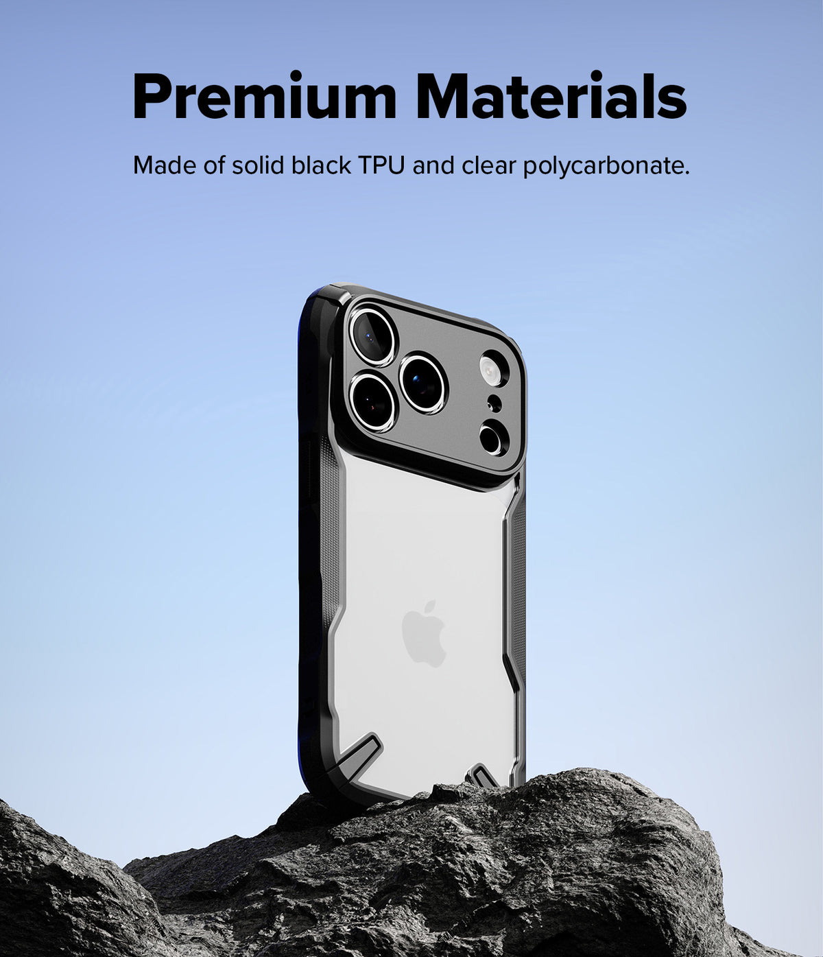iPhone 18 Pro Case | Fusion-X - A black and clear protective phone case stands upright on dark rocks against a light blue sky, with text at the top reading 'Premium Materials' and 'Made of solid black TPU and clear polycarbonate.' The Apple logo is visible through the case, but Apple is not the product brand, so visible_brands is empty.