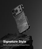 iPhone 18 Pro Case | Fusion-X - A black and gray camouflage-patterned phone case with a protective bumper frame, shown floating above a dark textured rock on a dark gray background. White text at the bottom reads 'Signature Style' and 'Sporty, shock-absorbing X-shaped frame.