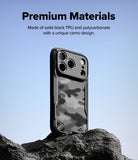 iPhone 18 Pro Case | Fusion-X - A black phone case with a gray and black camouflage pattern stands upright on a dark rock against a light blue sky. Text at the top reads 'Premium Materials' with a description of solid black TPU and polycarbonate materials with a unique camo design.