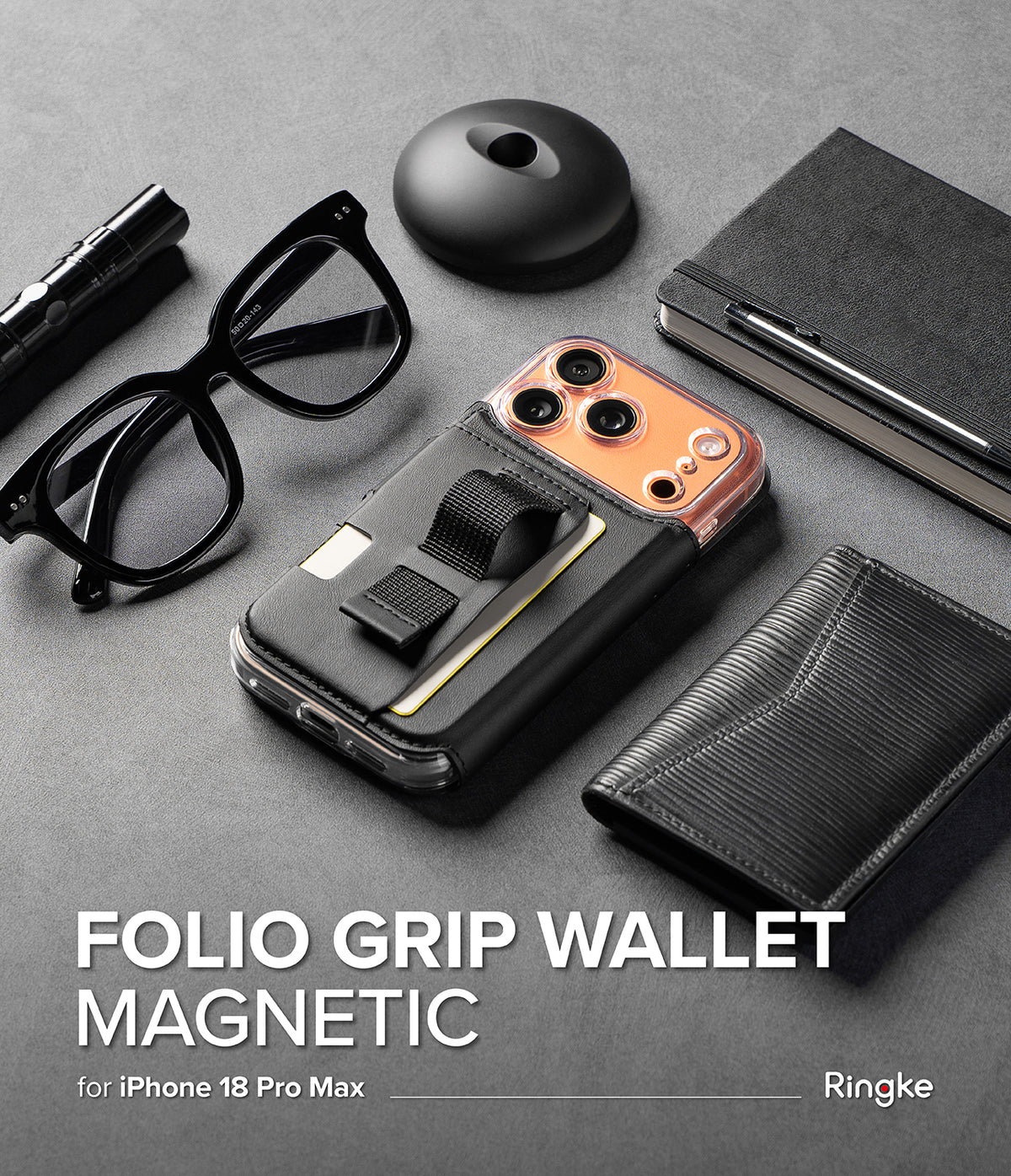 iPhone 18 Pro Max MagSafe Wallet | Folio Grip Wallet Magnetic - A black folio grip wallet phone case shown on a smartphone with an orange camera ring, arranged on a gray surface with glasses, a notebook, a pen, and a wallet. Large text reads 'FOLIO GRIP WALLET MAGNETIC' and 'for iPhone 18 Pro Max & 17 Pro Max' with 'Ringke' at the bottom right.
