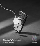 iPhone 18 Pro Max Case | Fusion-X Magnetic - A transparent magnetic phone case with a black bumper frame, shown floating on a dark gray surface with a white MagSafe ring and charging cable attached. Text at the bottom reads 'FUSION X MAGNETIC for iPhone 18 Pro Max & 17 Pro Max' with the Ringke logo.