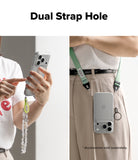 iPhone 18 Pro Case | Air - A promotional product image showing a clear phone case with a green adjustable shoulder strap and a dangling charm, demonstrated on a model. The left panel shows a close-up of hands holding the phone with the dangling charm, and the right panel shows the phone hanging from the waist strap.