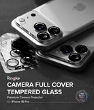 iPhone 18 Pro Camera Protector | Camera Full Cover Tempered Glass (2 Pack) - Ringke camera full cover tempered glass protector shown installed on two silver iPhone 18 Pro Max phones, with the packaging blister pack lying on a dark textured surface. Text overlay reads 'Ringke CAMERA FULL COVER TEMPERED GLASS Premium Camera Protector for iPhone 18 Pro Max'.