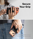 iPhone 18 Pro MagSafe Wallet | Folio Grip Wallet Magnetic - Two-panel lifestyle image showing a phone grip accessory being used on a smartphone. The top panel shows a person holding a phone with the black grip strap extended, and the bottom panel shows the same grip attached to a phone tucked into a pocket.