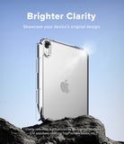 Apple iPad mini 8th A20 Pro Clear Case Ringke Fusion - A clear protective phone case shown on the back of a silver Apple iPhone, standing on dark rocks against a blue sky background. Text at the top reads 'Brighter Clarity' and the Apple logo is visible on the phone inside the case.