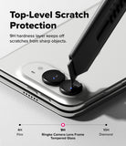 iPhone Duo | Fusion + Hinge (2P) all-groups - Close-up of a smartphone showing the rear camera area with text reading 'Top-Level Scratch Protection' and '9H hardness layer keeps off scratches from sharp objects.' A stylus is touching the camera lens area to demonstrate protection.