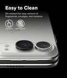 iPhone Duo | Fusion + Hinge (2P) all-groups - Close-up of a smartphone showing two circular camera lens protectors applied to the rear camera module, with marketing text reading 'Easy to Clean' and icons for True Touch and Anti-Fingerprint on a black background.